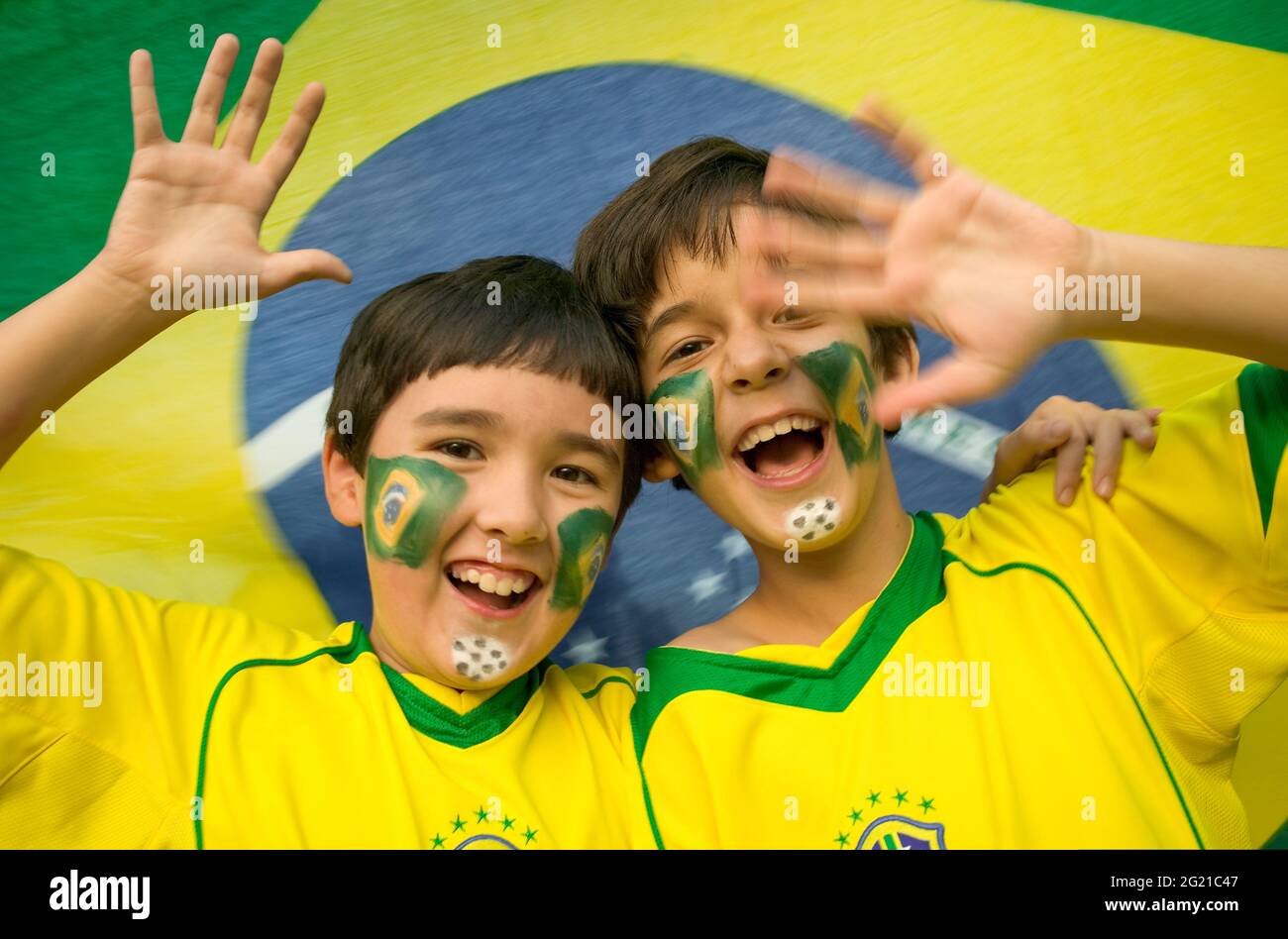 Boys (9 yrs old) celebrating with Brazilian Flag face paint wearing