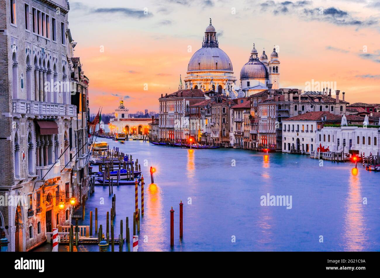 Venice, Italy. Gorgeous view of the Grand Canal and Basilica Santa Maria della Salute during sunset with amazing clouds. Stock Photo