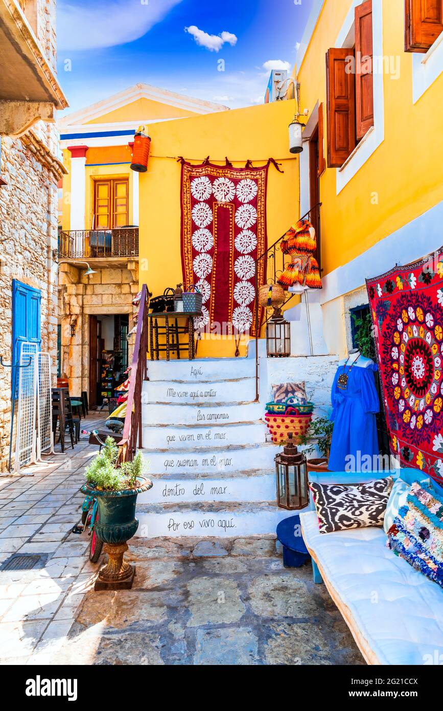 Symi Island, Greece. Greece islands holidays vacation travel tours from Rhodos island in Aegean Sea. Colorful neoclassical houses in bay of Symi. Stock Photo