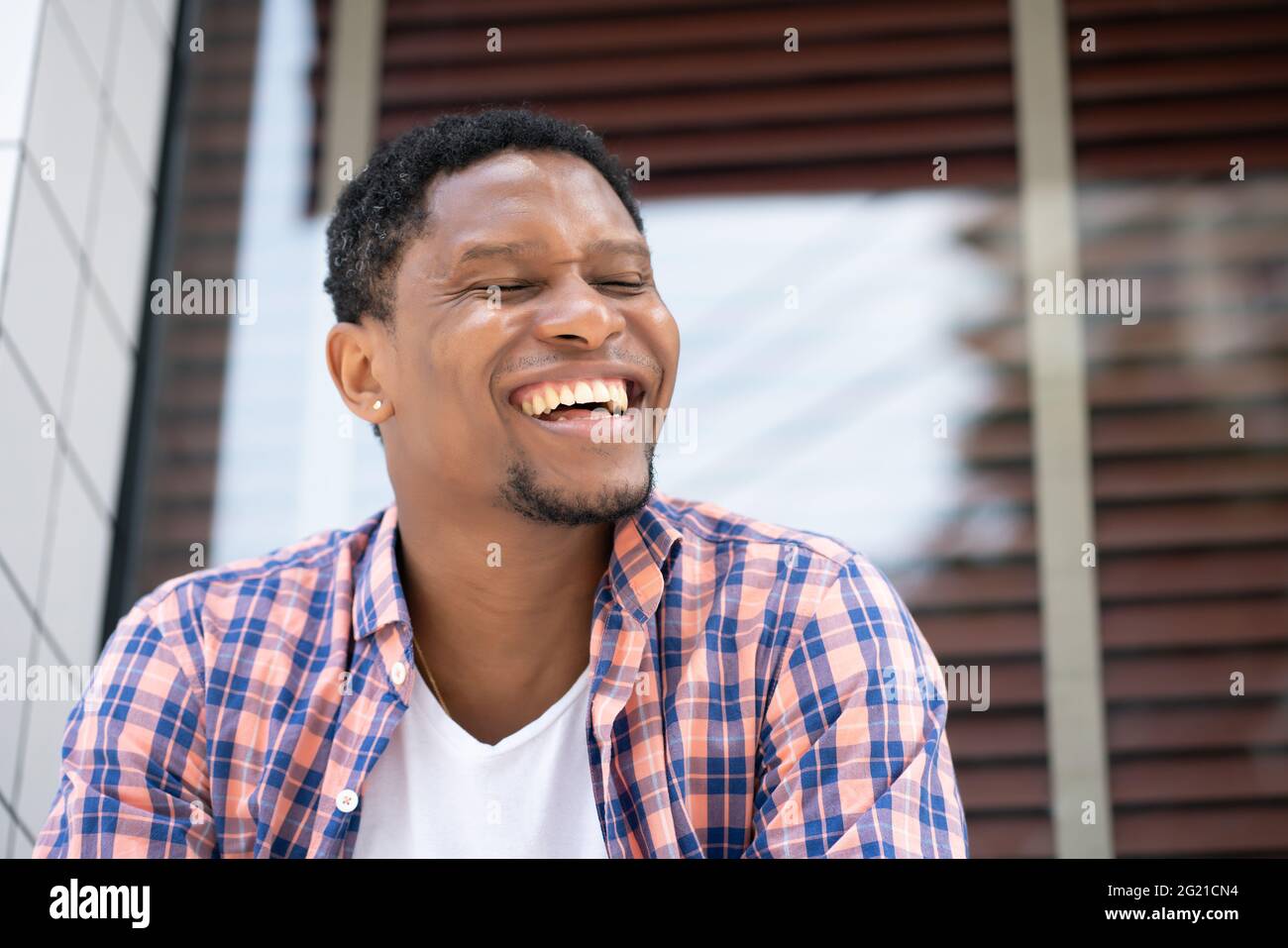 African american man sitting hi-res stock photography and images - Alamy