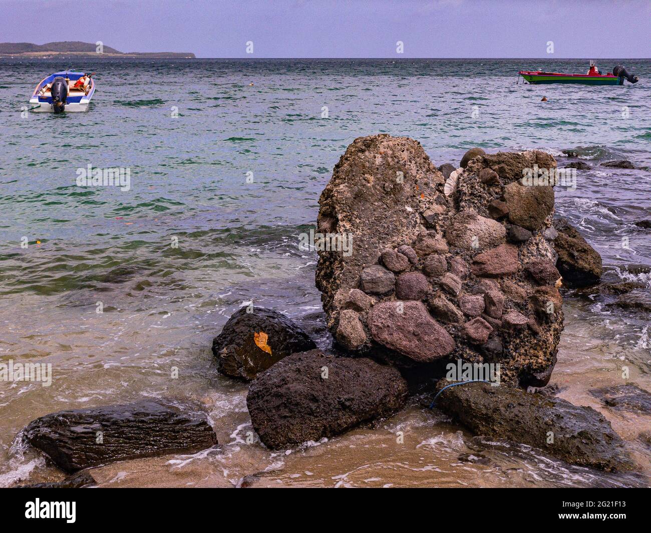 This rock is used as a mooring for fishing boats during gales Stock ...