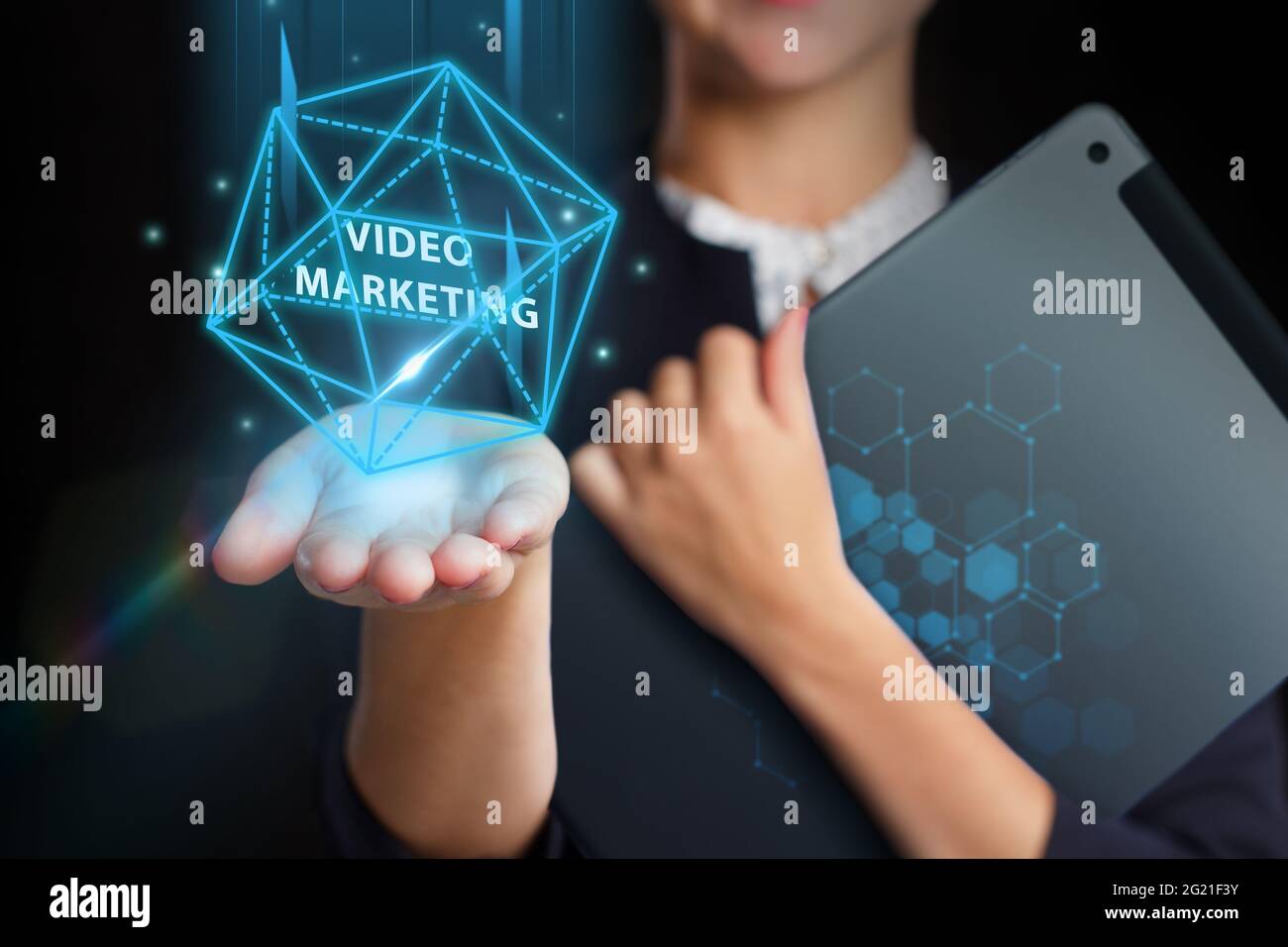 Business, Technology, Internet and network concept. Young businessman working on a virtual screen of the future and sees the inscription: Video market Stock Photo