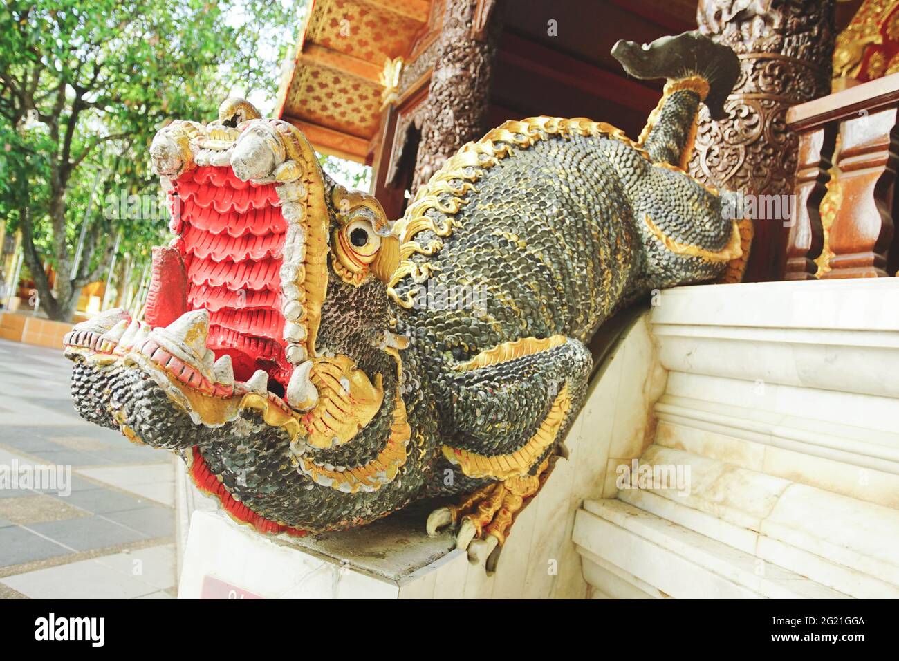 Chiang Mai, Thailand - December 17, 2020: Mythical Mom guardian is an imaginary animal shaped like a lion mixed with a dragon decorated in Wat Phra Th Stock Photo