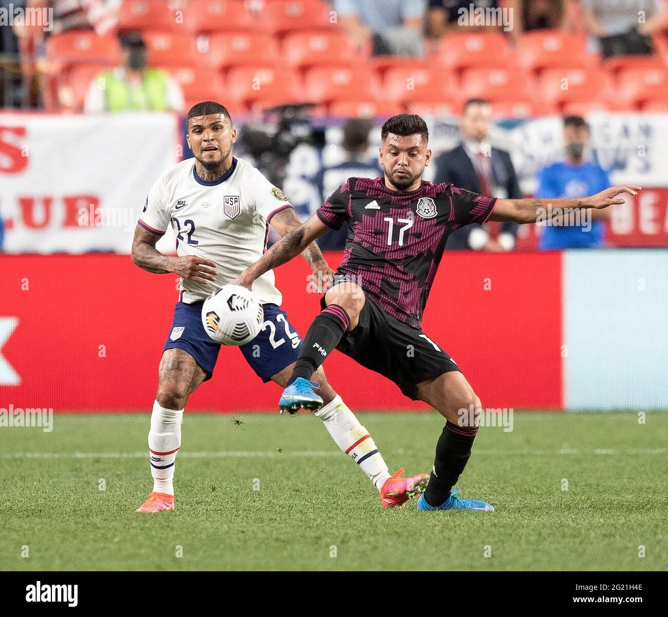 Denver, Colorado, USA. 6th June, 2021. Mexico F JESUS CORONA, right, battles with USA D DEANDRE YEDLIN, left, Sunday evening at Empower Field at Mile High. USA beats Mexico 3-2 in Overtime and win the Inaugural Concacaf Nations League Cup. Credit: Hector Acevedo/ZUMA Wire/Alamy Live News Stock Photo