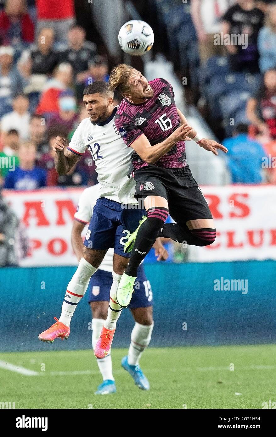 Denver, Colorado, USA. 6th June, 2021. Mexico MF HECTOR MORENO, right, goes up for a header with USA D DEANDRE YEDLIN, left, Sunday evening at Empower Field at Mile High. USA beats Mexico 3-2 in Overtime and win the Inaugural Concacaf Nations League Cup. Credit: Hector Acevedo/ZUMA Wire/Alamy Live News Stock Photo