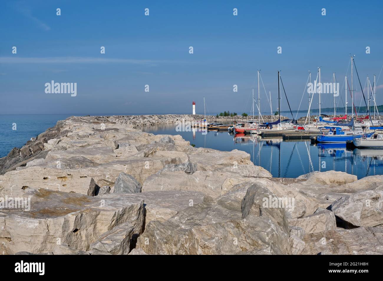 Stone breakwall protects small pleasure craft docked at Meaford Harbour. Stock Photo