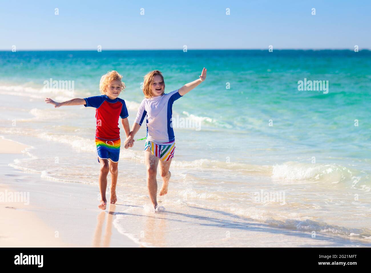 Kids Playing On Tropical Beach. Children Swim And Play At Sea On Summer ...