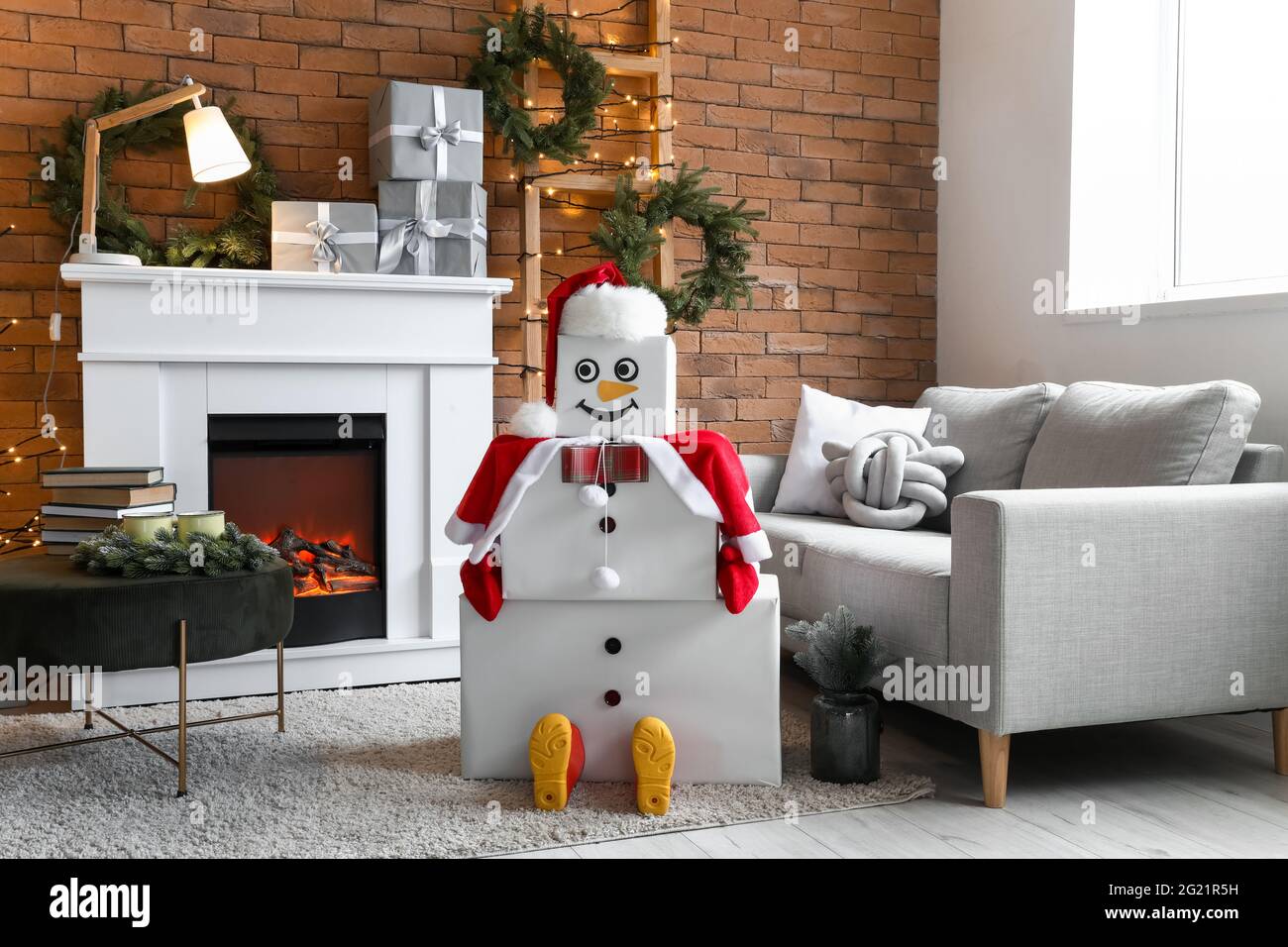 Interior of living room with fireplace and decorative snowman Stock ...