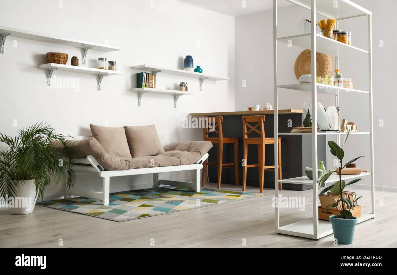 Interior of modern kitchen with shelf unit Stock Photo - Alamy