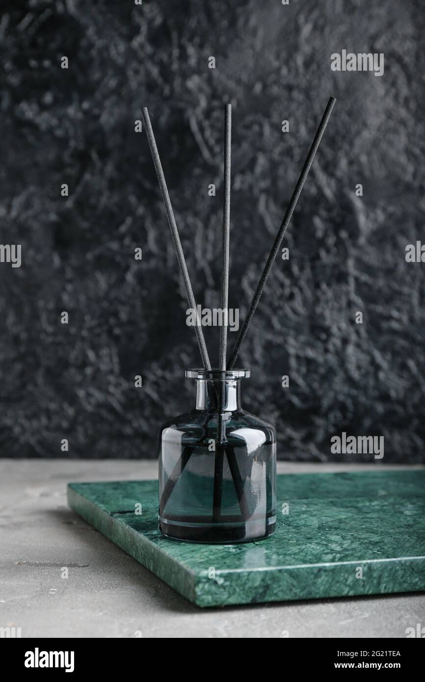 Reed diffuser on dark background Stock Photo