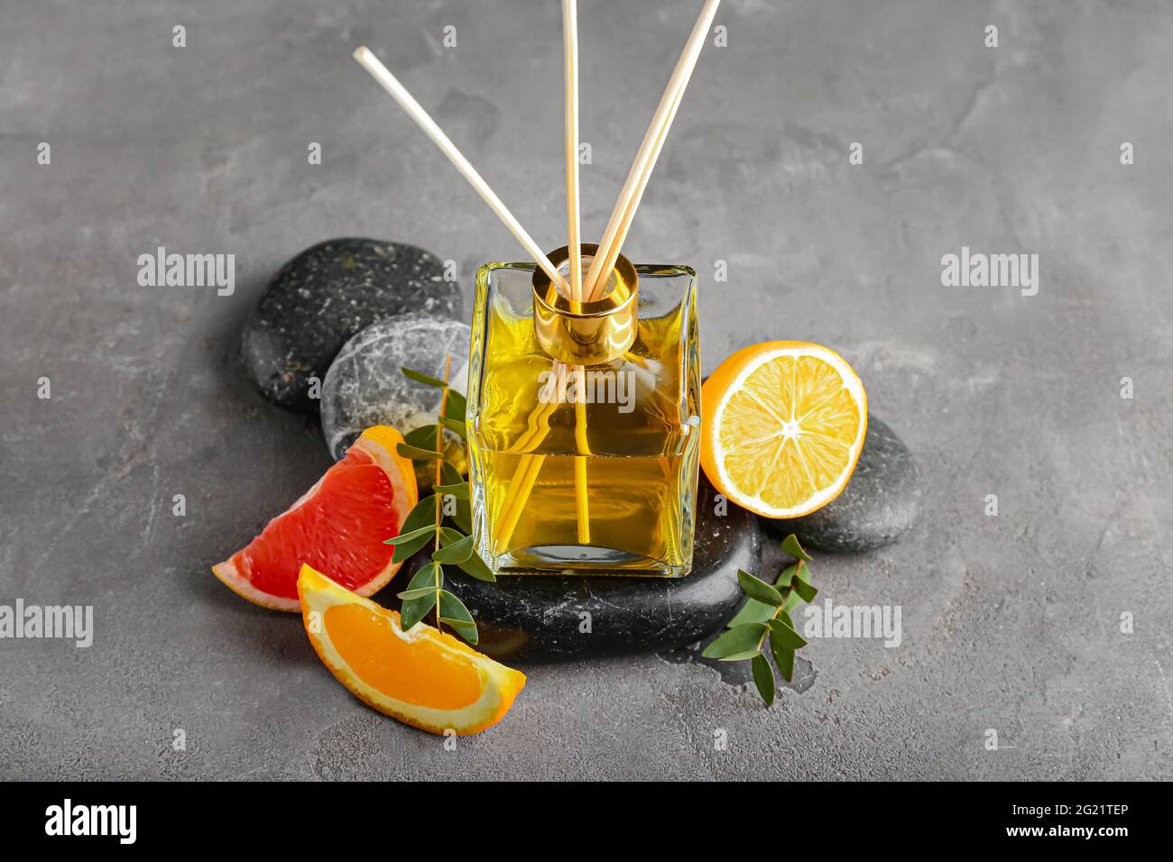 Citrus reed diffuser on grunge background Stock Photo