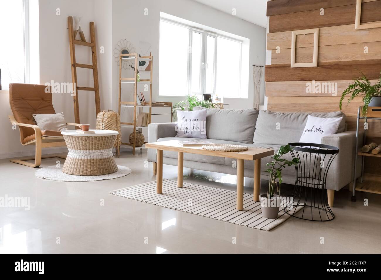 Stylish interior of living room with comfortable sofa Stock Photo - Alamy