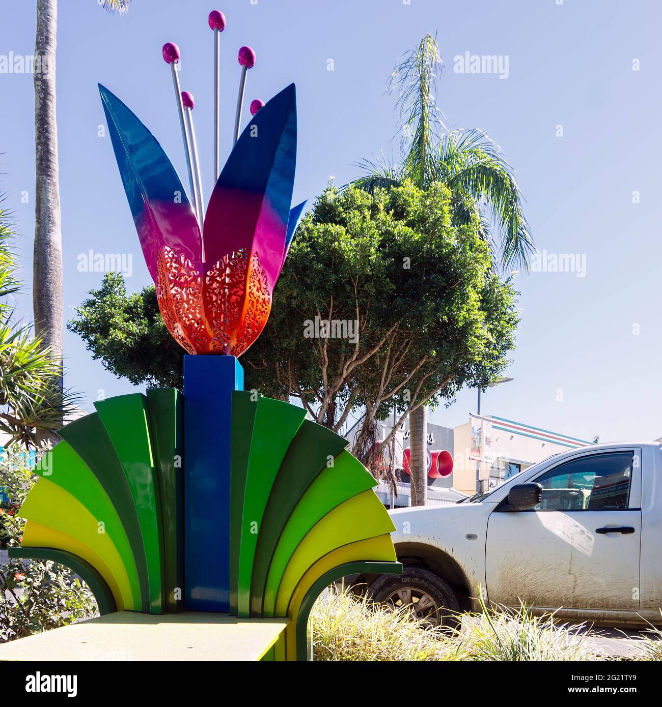 Metal street art in the form of a flower designed in by Brian Robinson and in the Mackay City Heart adds colour and interest to the street scape. Squa Stock Photo