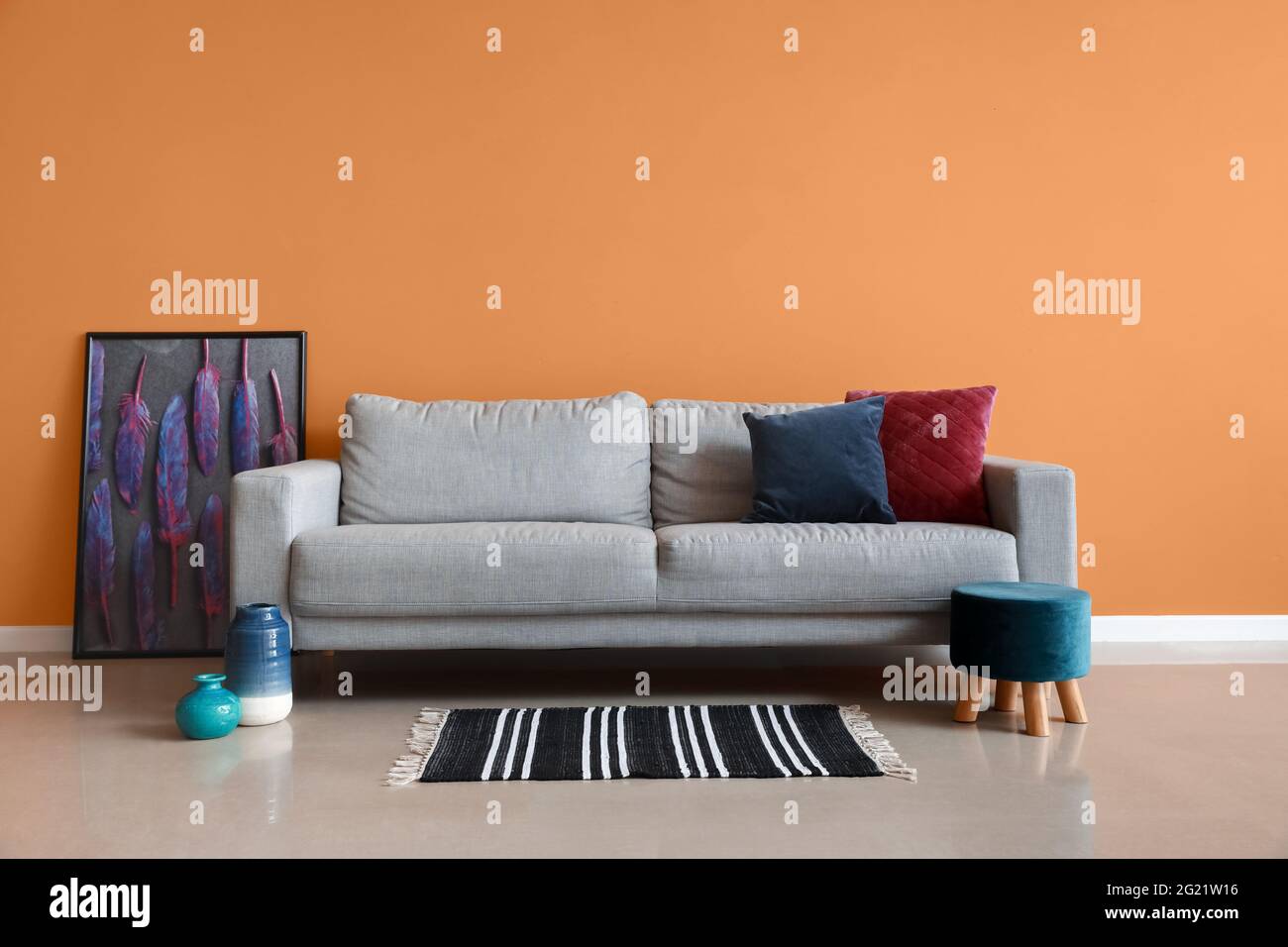 Stylish interior of living room with cozy sofa Stock Photo - Alamy