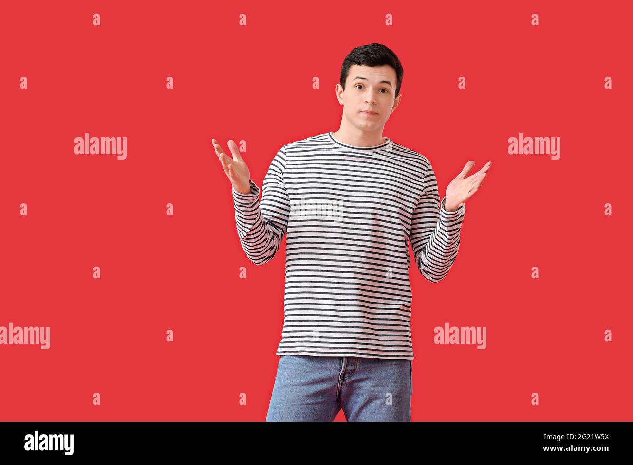 Confused brunette man in red hi-res stock photography and images - Alamy
