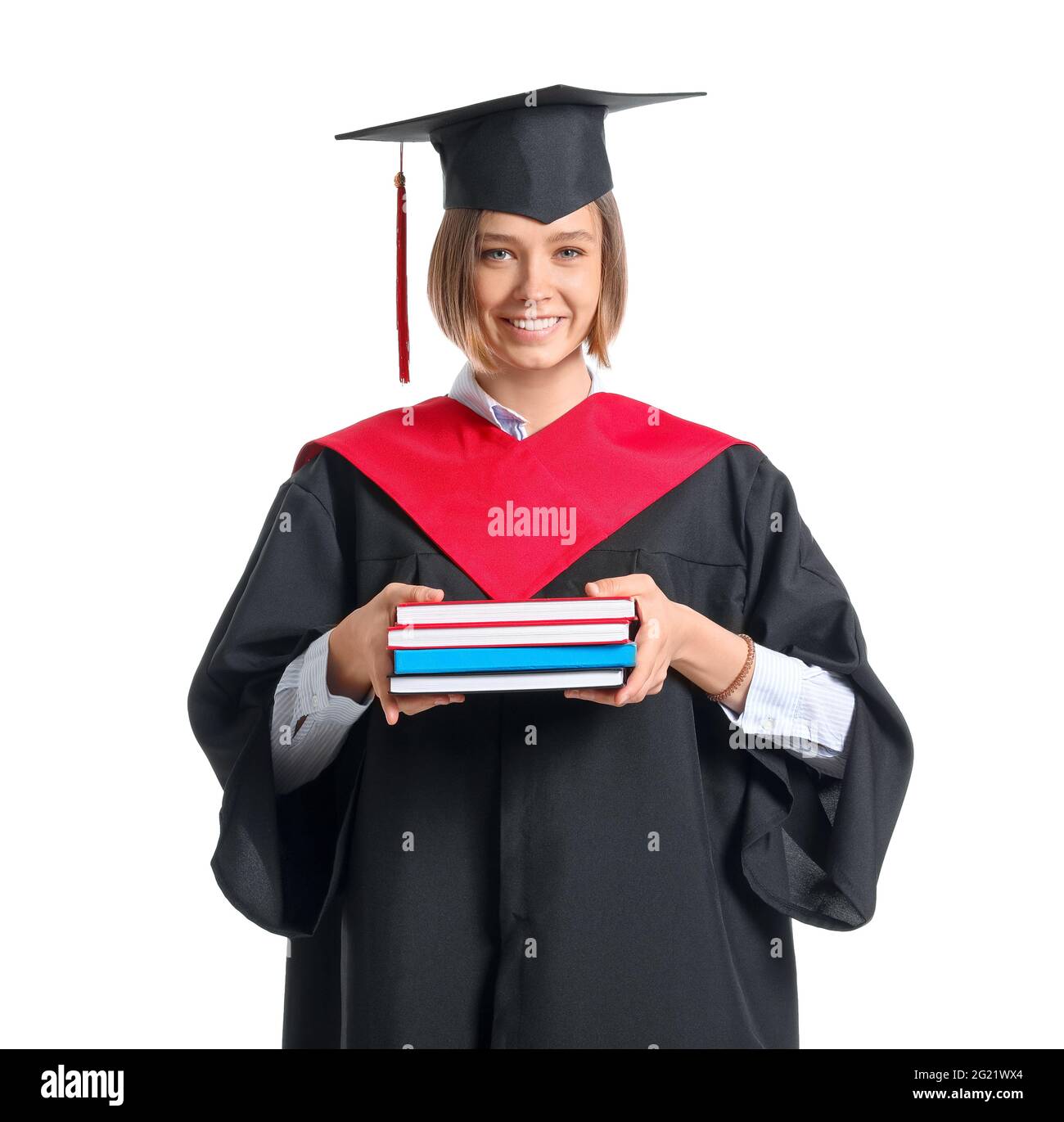 Female graduating student with books on white background Stock Photo ...