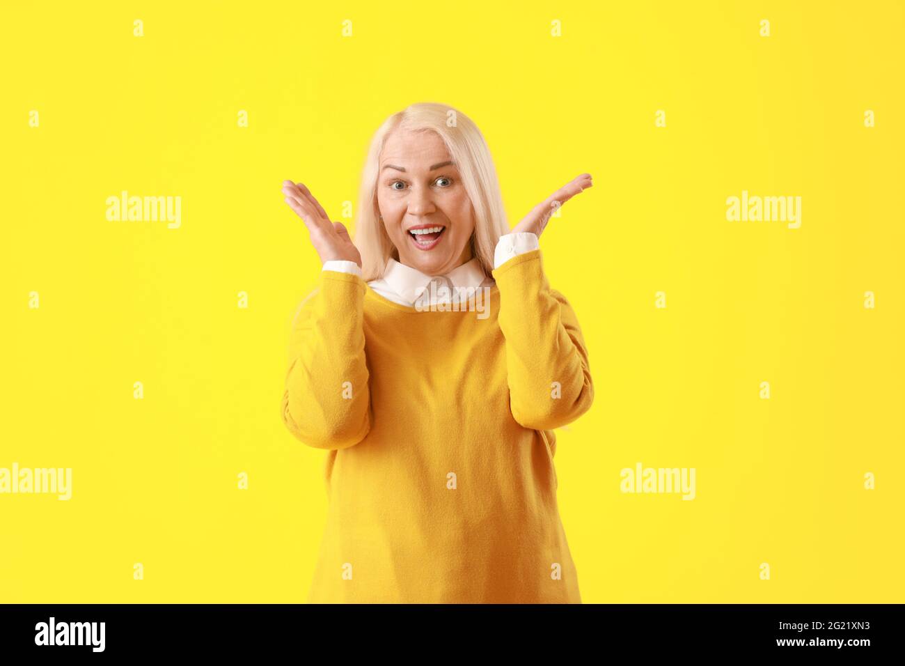Mature blonde woman surprised expression hi-res stock photography and ...