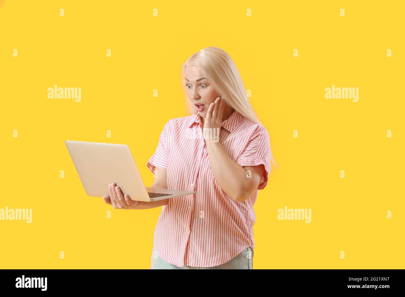 Mature blonde woman surprised expression hi-res stock photography and ...