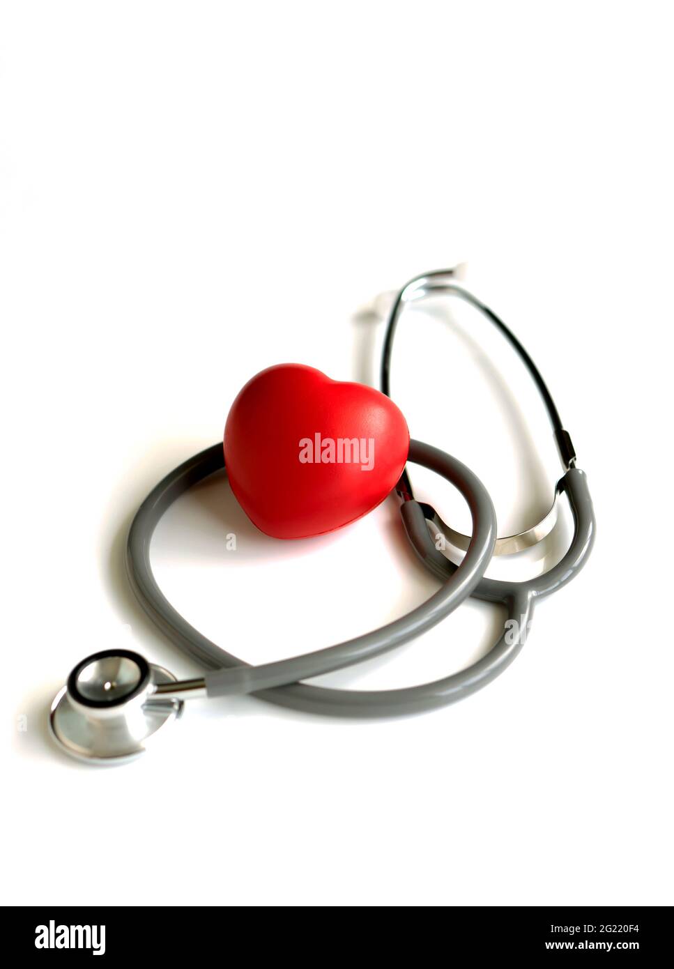 A heart with a stethoscope, isolated on white background Stock Photo ...