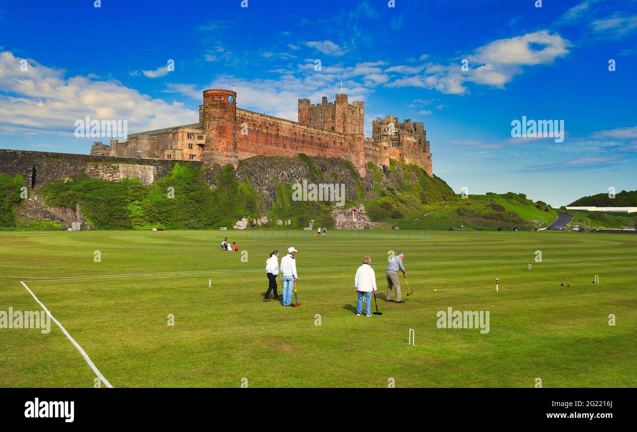 A game of Croquet in front of Bamburgh Castle, Northumberland, England