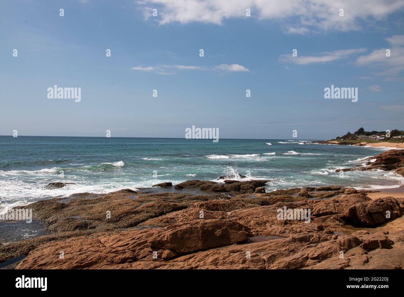 Close up of waves breaking on rocks on shoreline Stock Photo - Alamy