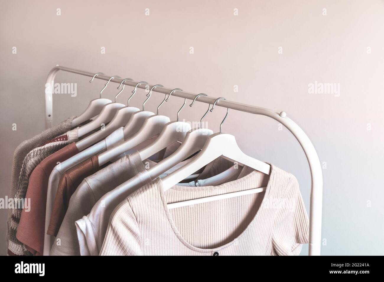 Rack with stylish women's summer clothes. Concept for shopping store, beauty, fashion. Stock Photo