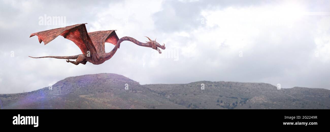 dragon flying above a landscape Stock Photo