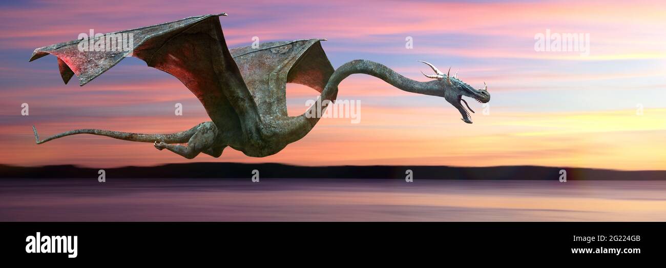 dragon, fast flying magical creature during sunrise Stock Photo