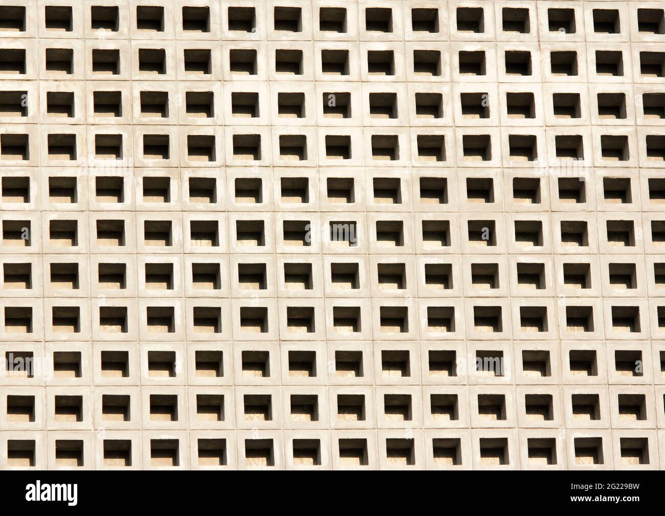 Perforated cement block wall background with shadow Stock Photo - Alamy