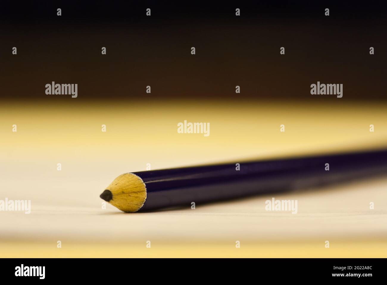 A blue pencil on blank white paper Stock Photo Alamy