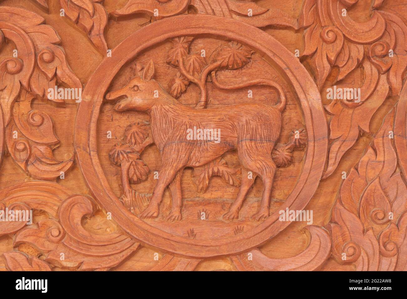 Wood carving of dog Chinese zodiac animal sign Stock Photo Alamy