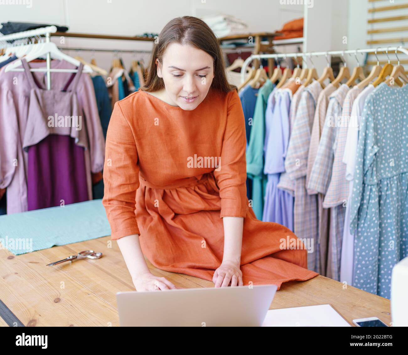 seamstress creating clothing design ...