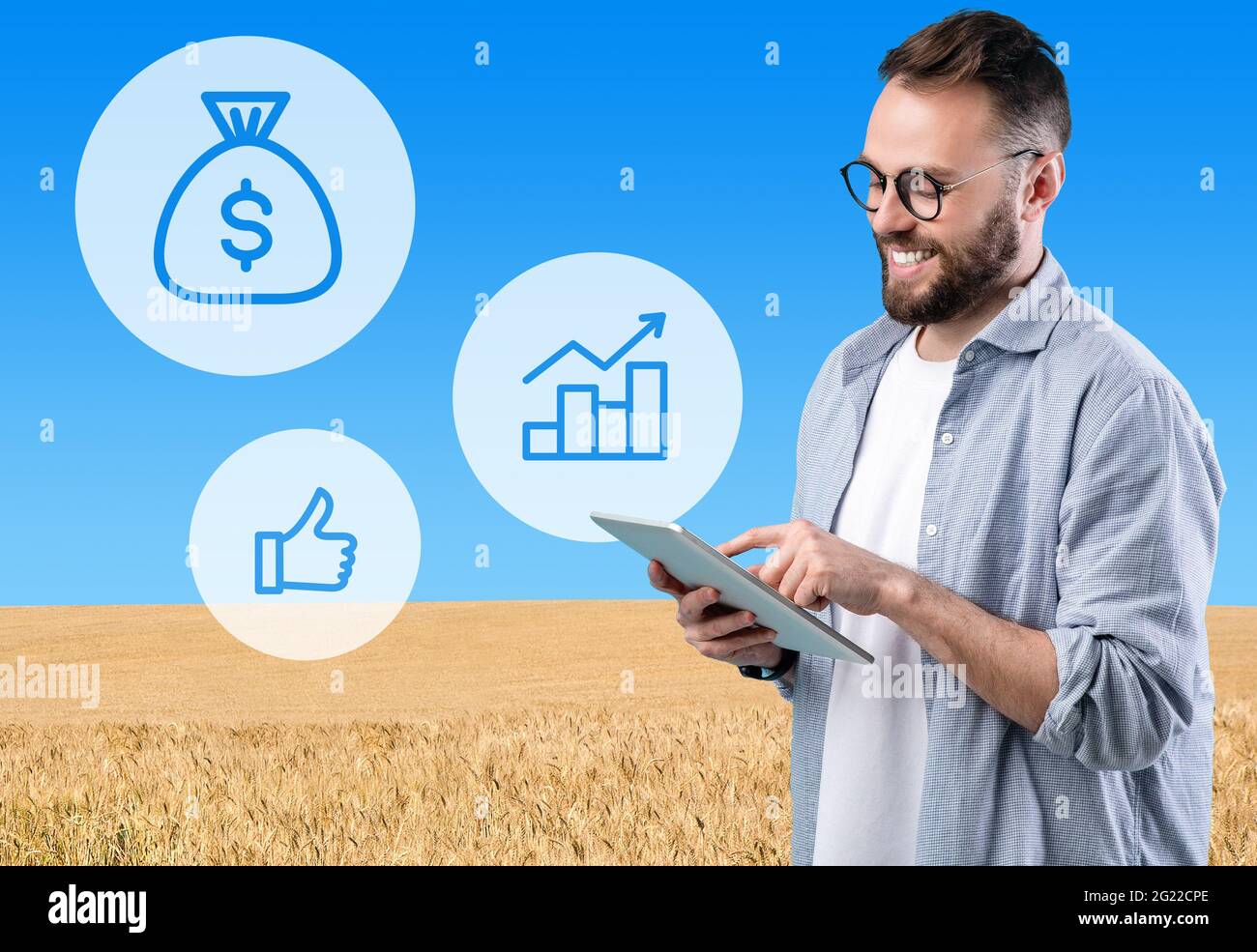 Millennial businessman using digital tablet while working on farm Stock Photo