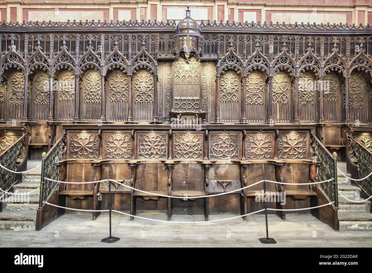 Closeup Shot Of Carved Wooden Seats In The Choir Of The Gothic