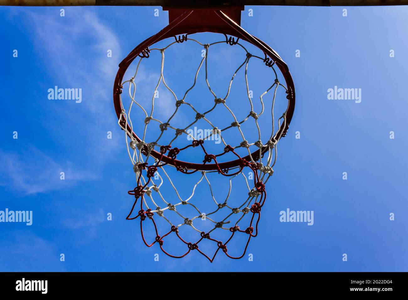 A view of a basketball hoop from below Stock Photo