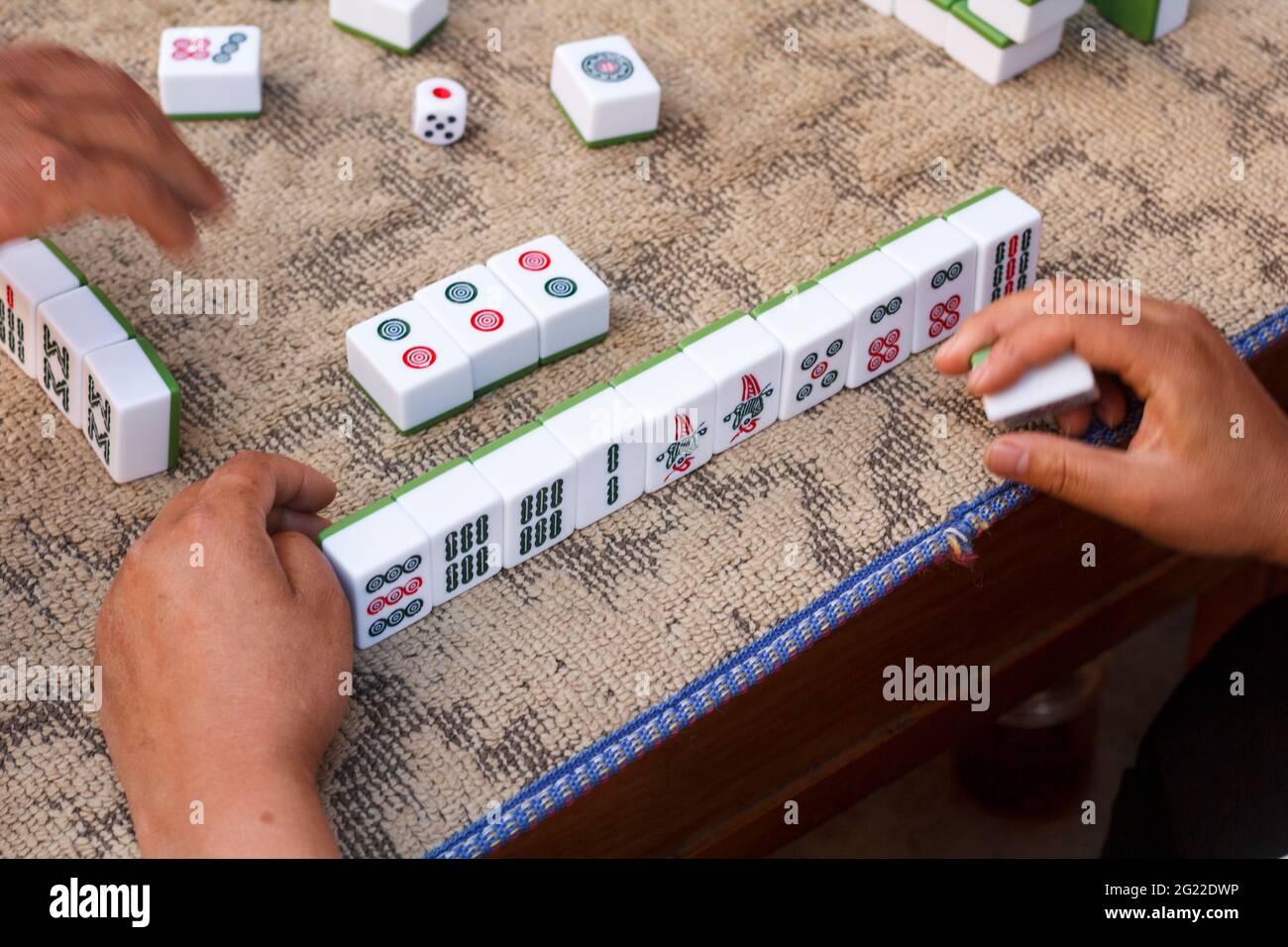 People playing mahjong on street, Yunnan China. Stock Photo