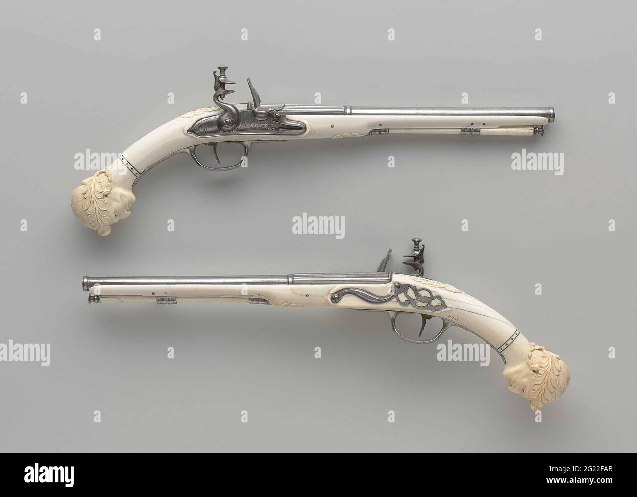 Pair of flintlock pistols. Jacob Kosters, originally from Germany, moved to Maastricht in 1651. He lived in the house known as Het Hangende Zwaard (The Hanging Sword) and was a member of the guild of merchants. Various craftsmen – barrel makers, stock makers and lock makers – supplied Kosters with parts that he assembled into complete weapons, which he then signed on the lockplate. Stock Photo