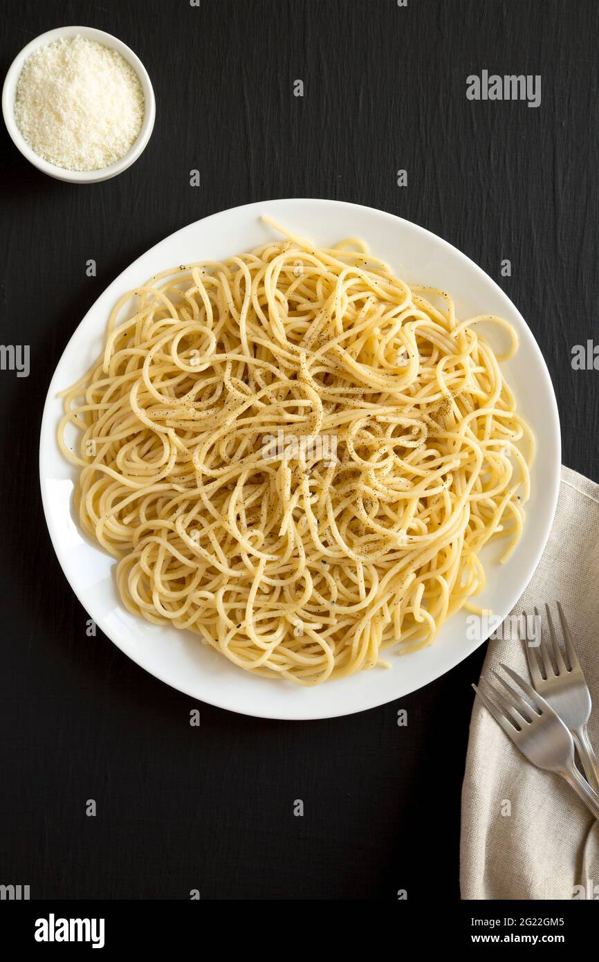 Homemade Cacio E Pepe Pasta with Pecorino Romano and Pepper on a white