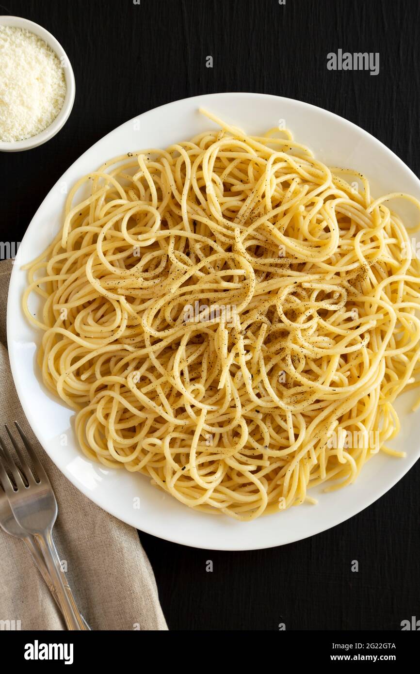 Homemade Cacio E Pepe Pasta with Pecorino Romano and Pepper on a white