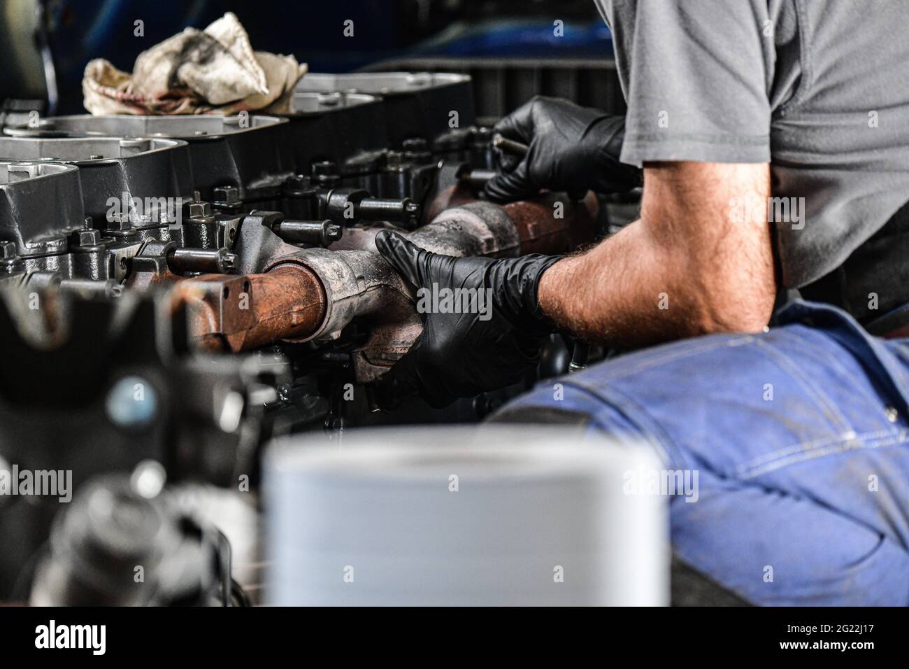 Mechanic truck repairing an engine. close up shot Stock Photo