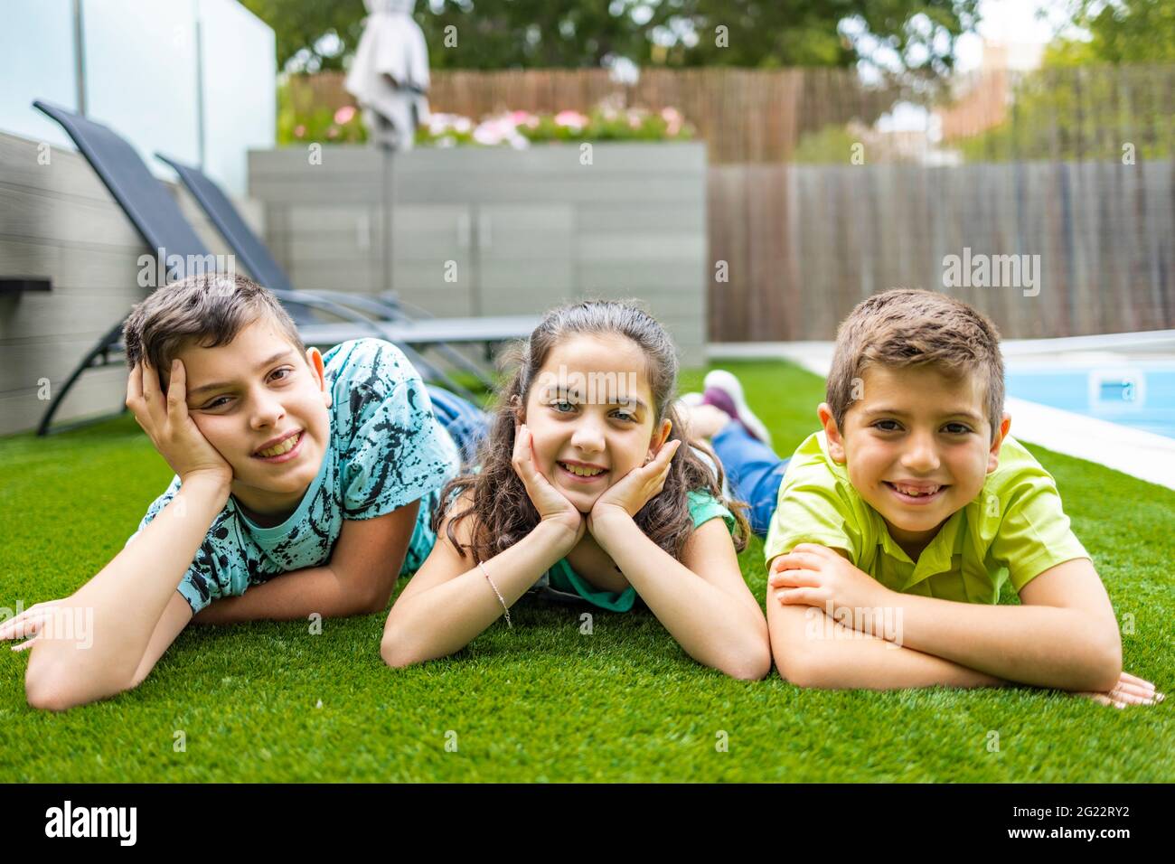A boy and a girl lying on grass hi-res stock photography and images - Alamy
