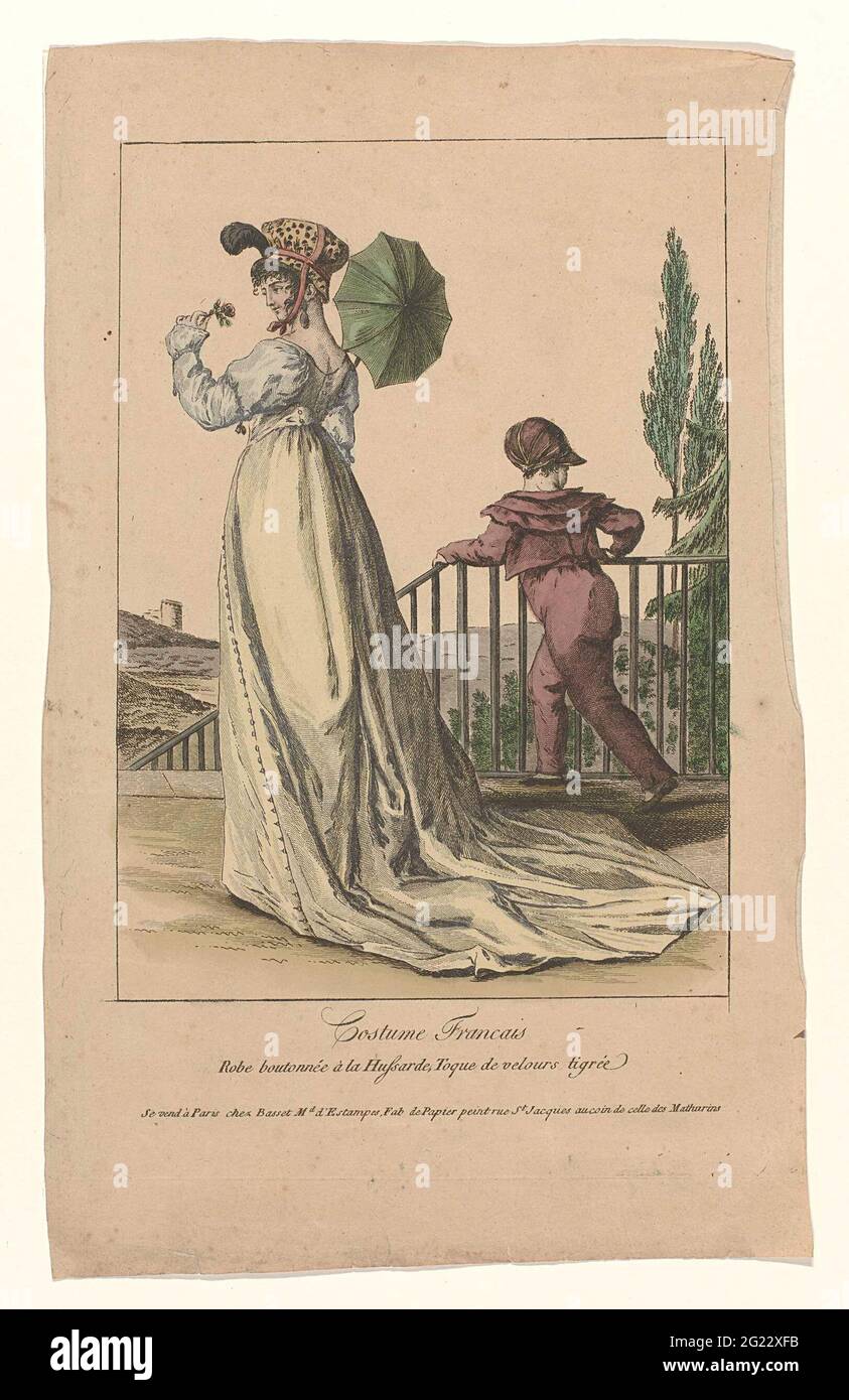 Woman left in a dress with buttons à la Hussarde. Long sleeves and drag. On  the head a 'toque' of dotted velvet. Further accessories: earring in the  left ear, parasol. Flower in