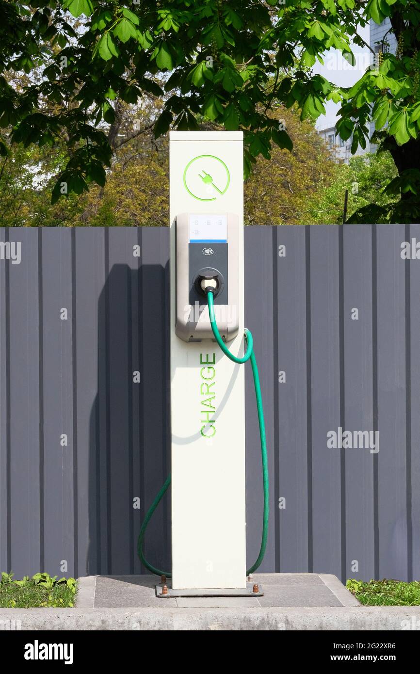 Electric charging station. Eco friendly transport concept. Sign on front of charging station. Vertical view. Stock Photo
