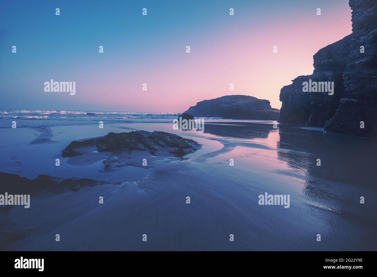 Seascape in the morning. Rocky sea coast at sunrise. Beach Playa de Las Catedrales in Ribadeo, Galicia, Spain, Europe Stock Photo