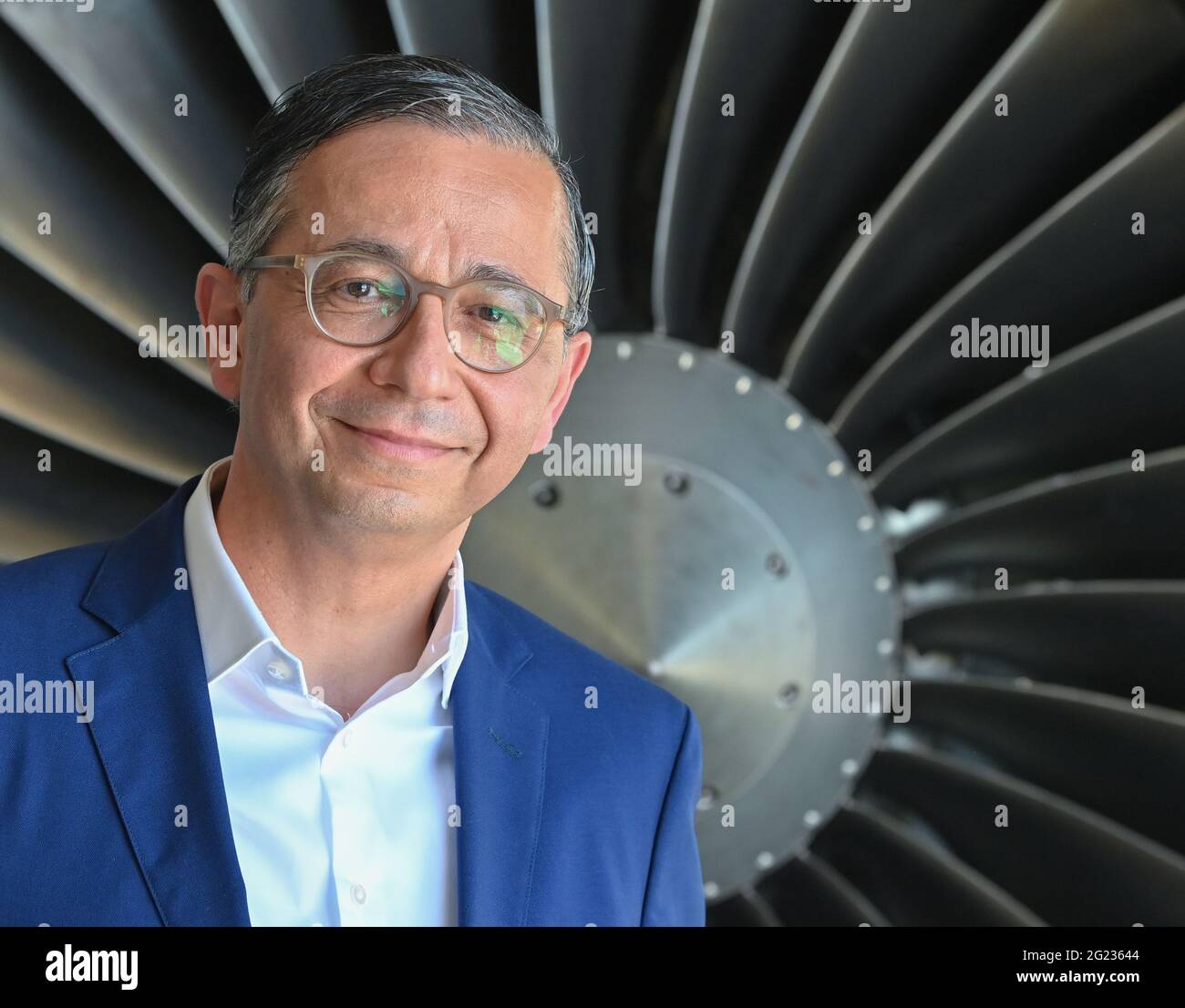 Ludwigsfelde, Germany. 07th June, 2021. André Sinanian, managing director of MTU Maintenance Berlin-Brandenburg GmbH, stands in front of an engine. Credit: Patrick Pleul/dpa-Zentralbild/ZB/dpa/Alamy Live News Stock Photo