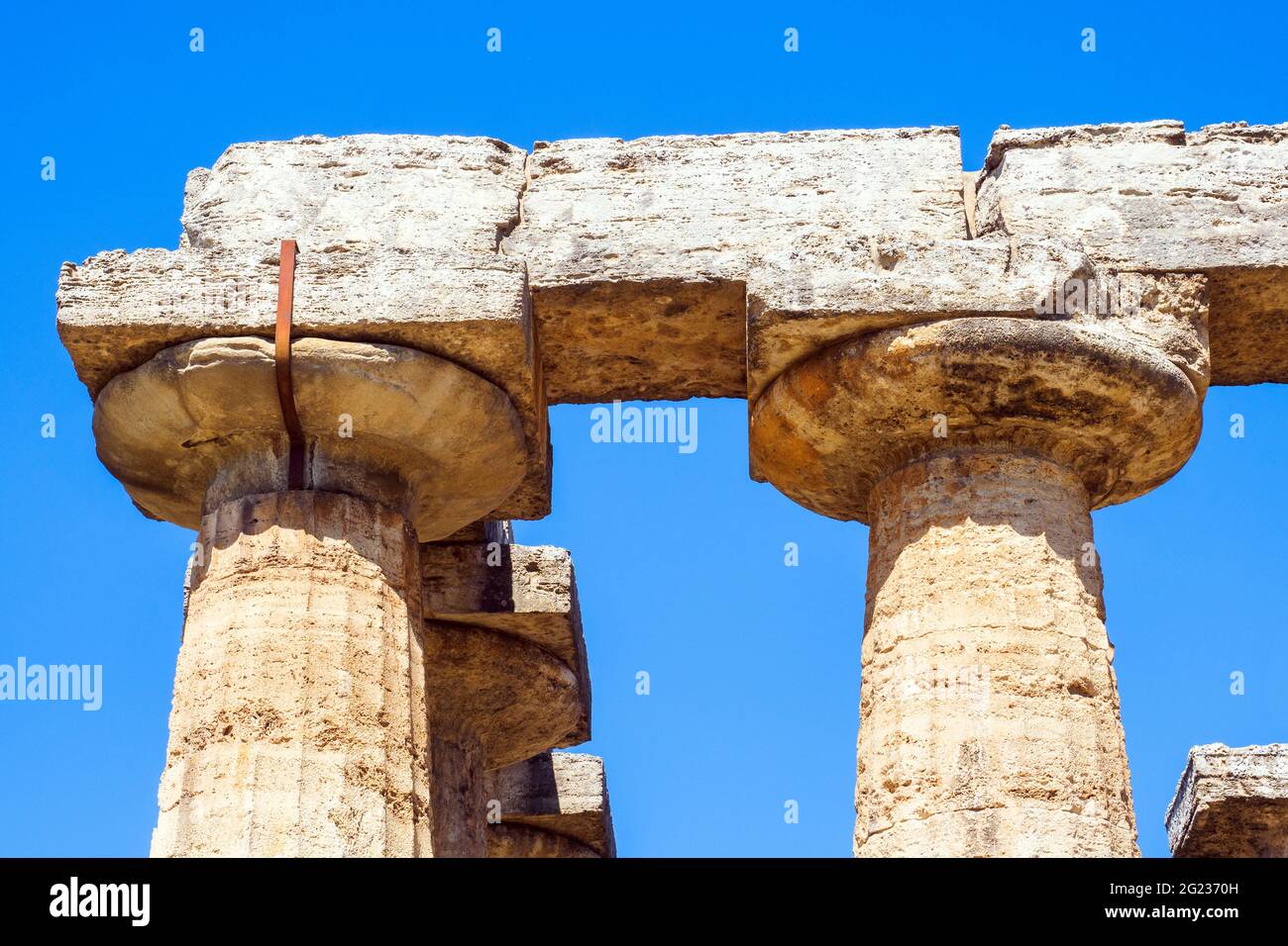 Detail of the Greek doric style temple of Hera (archaic temple) - Archaeological Area of Paestum - Salerno, Italy Stock Photo