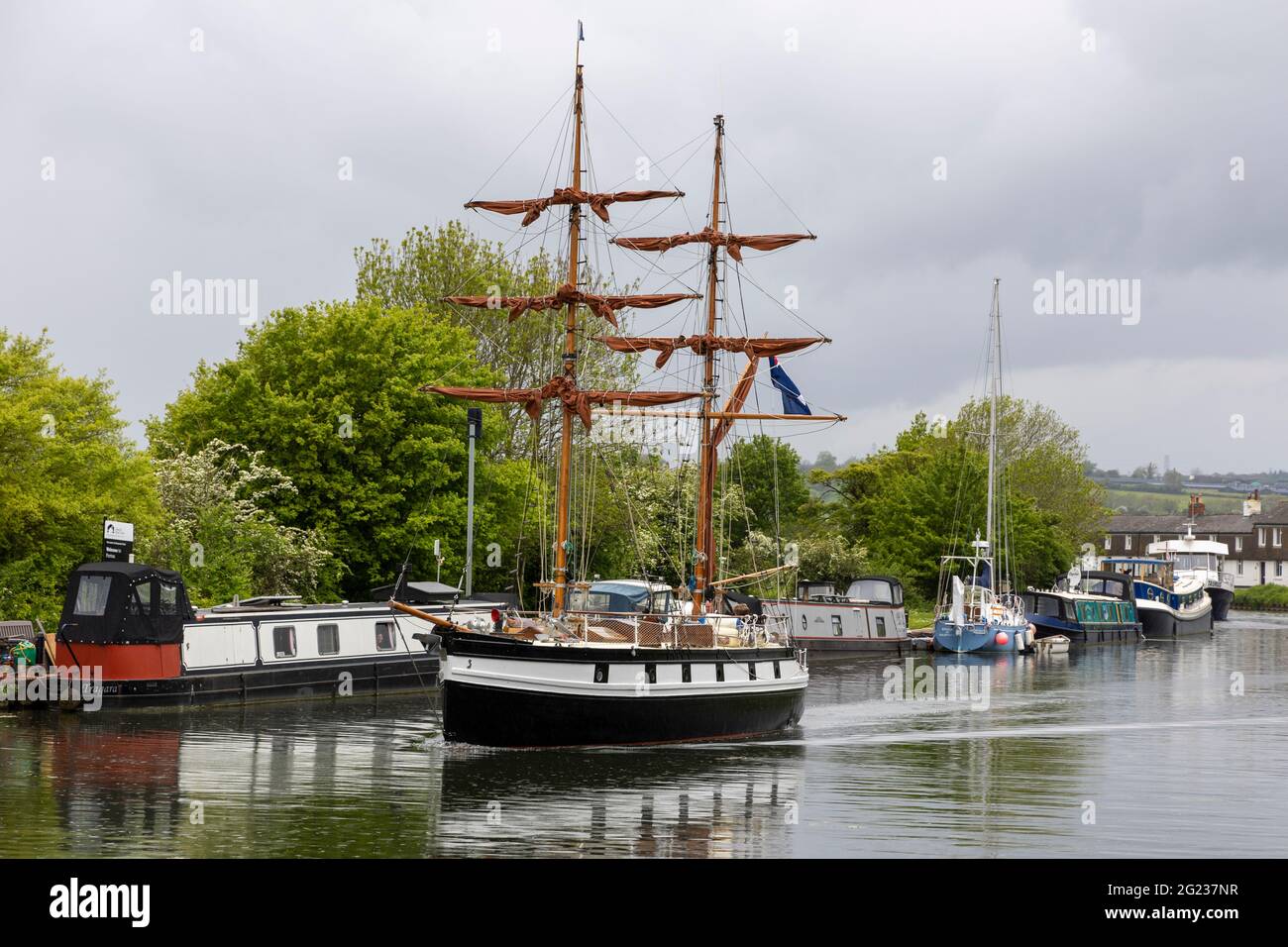 A mock two masted square rigger  passes through Purton lower swing bridge on the Sharpness and Gloucester ship canal Stock Photo