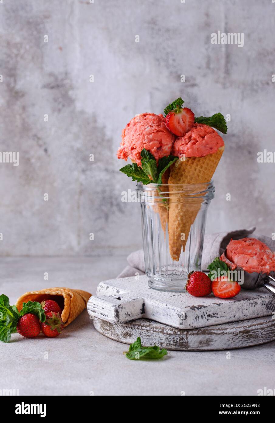 Strawberry ice cream in waffle cone Stock Photo - Alamy