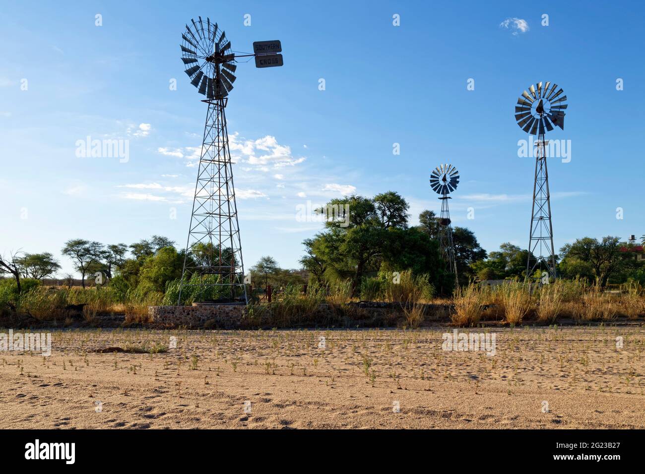 Windmills of a farm at the banks of the dry Omaruru river (dry river) near Omaruru, Erongo Region, Namibia Stock Photo