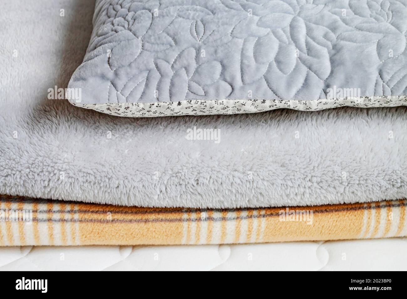 Two blankets and pillow on the mattress. Graphic resources Stock Photo